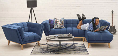 Woman Listening to music on a blue sofa